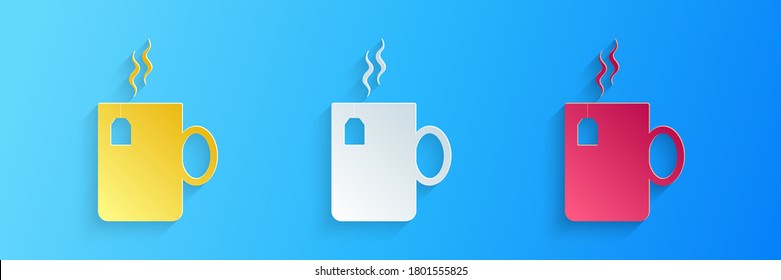 Paper cut Cup of tea with tea bag icon isolated on blue background. Paper art style. Vector.