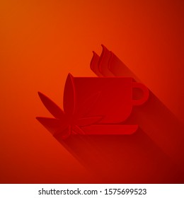 Paper cut Cup tea with marijuana or cannabis leaf icon isolated on red background. Marijuana legalization. Hemp symbol. Paper art style. Vector Illustration