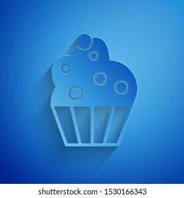 Paper cut Cupcake icon isolated on blue background. Paper art style. Vector Illustration