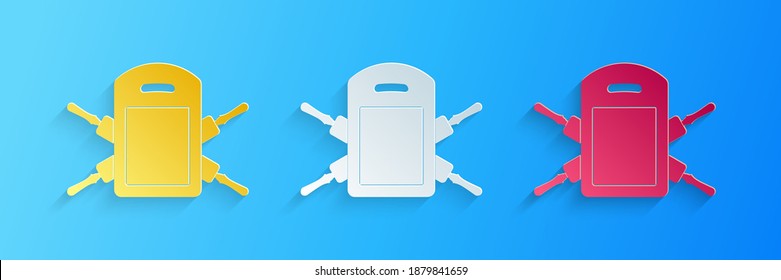 Paper cut Cutting board and rolling pins icon isolated on blue background. Kitchen utensils and equipment. Paper art style. Vector.