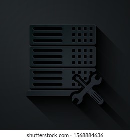 Paper cut Database server with screwdriver and wrench icon isolated on black background. Adjusting, service, setting, maintenance, repair, fixing. Paper art style. Vector Illustration