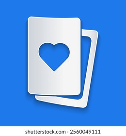 Paper cut Deck of playing cards icon isolated on blue background. Casino gambling. Paper art style. Vector