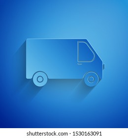 Paper cut Delivery cargo truck vehicle icon isolated on blue background. Paper art style. Vector Illustration