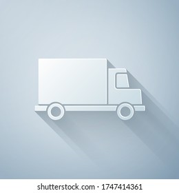 Paper cut Delivery cargo truck vehicle icon isolated on grey background. Paper art style. Vector Illustration