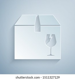Paper cut Delivery package box with fragile content symbol of broken glass icon isolated on grey background. Box, package, parcel sign. Paper art style. Vector Illustration