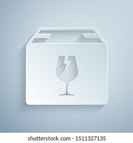 Paper cut Delivery package box with fragile content symbol of broken glass icon isolated on grey background. Box, package, parcel sign. Paper art style. Vector Illustration