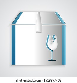 Paper cut Delivery package box with fragile content symbol of broken glass icon isolated on grey background. Box, package, parcel sign. Paper art style. Vector Illustration