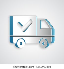 Paper cut Delivery truck with check mark icon isolated on grey background. Paper art style. Vector Illustration