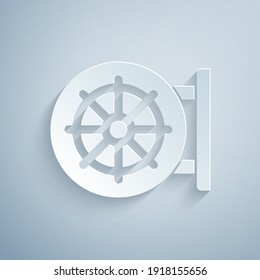 Paper cut Dharma wheel icon isolated on grey background. Buddhism religion sign. Dharmachakra symbol. Paper art style. Vector.