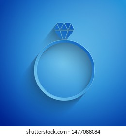 Paper cut Diamond engagement ring icon isolated on blue background. Paper art style. Vector Illustration