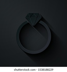 Paper cut Diamond engagement ring icon isolated on black background. Paper art style. Vector Illustration