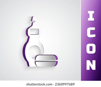 Paper cut Dishwashing liquid bottle icon isolated on grey background. Liquid detergent for washing dishes. Paper art style. Vector