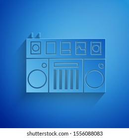 Paper cut DJ remote for playing and mixing music icon isolated on blue background. DJ mixer complete with vinyl player and remote control. Paper art style. Vector Illustration