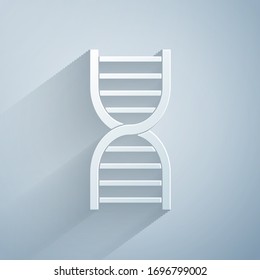 Paper cut DNA symbol icon isolated on grey background. Paper art style. Vector Illustration