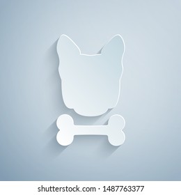 Paper cut Dog and bone icon isolated on grey background. Pets food symbol. Paper art style. Vector Illustration