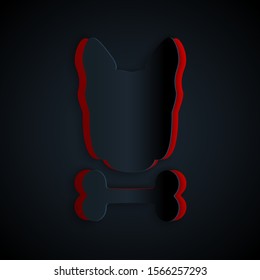 Paper cut Dog and bone icon isolated on black background. Pets food symbol. Paper art style. Vector Illustration