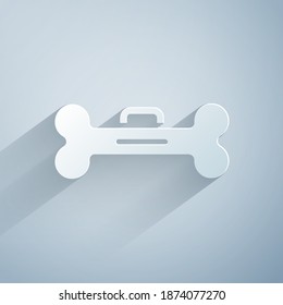 Paper cut Dog bone icon isolated on grey background. Pets food symbol. Paper art style. Vector