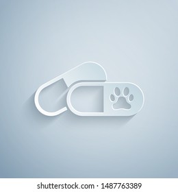 Paper cut Dog and pills icon isolated on grey background. Prescription medicine for animal. Paper art style. Vector Illustration