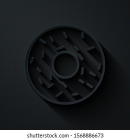 Paper cut Donut with sweet glaze icon isolated on black background. Paper art style. Vector Illustration
