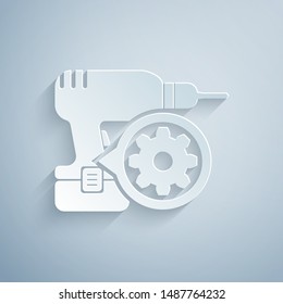 Paper cut Drill machine and gear icon isolated on grey background. Adjusting app, service concept, setting options, maintenance, repair, fixing. Paper art style. Vector Illustration