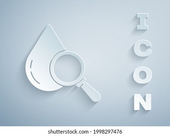 Paper cut Drop and magnifying glass icon isolated on grey background. Paper art style. Vector Illustration