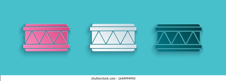 Paper cut Drum icon isolated on blue background. Music sign. Musical instrument symbol. Paper art style. Vector Illustration