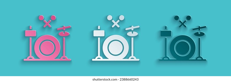 Paper cut Drums icon isolated on blue background. Music sign. Musical instrument symbol. Paper art style. Vector