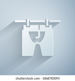 Paper cut Drying clothes icon isolated on grey background. Clean shirt. Wash clothes on a rope with clothespins. Clothing care and tidiness. Paper art style. Vector