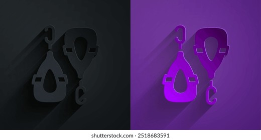 Icono de pendientes de corte de papel aislado en negro sobre fondo púrpura. Accesorios de joyería. Estilo de arte de papel. Vector