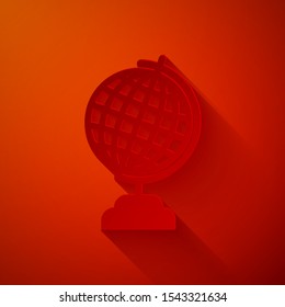 Paper cut Earth globe icon isolated on red background. Paper art style. Vector Illustration