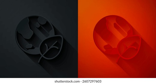 Paper cut Earth globe and leaf icon isolated on black and red background. World or Earth sign. Geometric shapes. Environmental concept. Paper art style. Vector