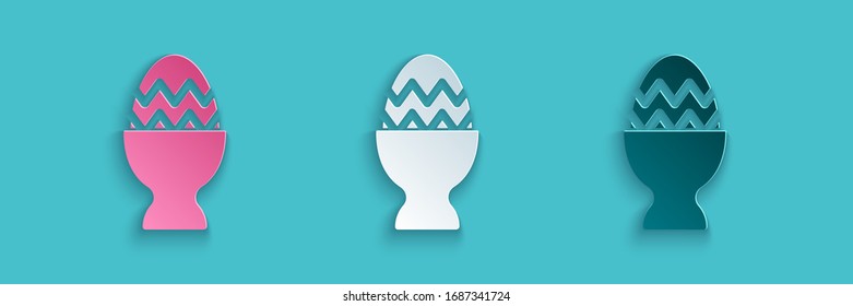 Paper cut Easter egg on a stand icon isolated on blue background. Happy Easter. Paper art style. Vector Illustration