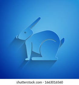 Paper cut Easter rabbit icon isolated on blue background. Easter Bunny. Paper art style. Vector Illustration