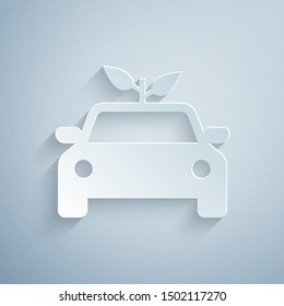 Paper cut Eco car concept drive with leaf icon isolated on grey background. Green energy car symbol. Paper art style. Vector Illustration