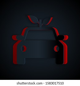 Paper cut Eco car concept drive with leaf icon isolated on black background. Green energy car symbol. Paper art style. Vector Illustration