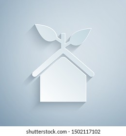 Paper cut Eco friendly house icon isolated on grey background. Eco house with leaf. Paper art style. Vector Illustration
