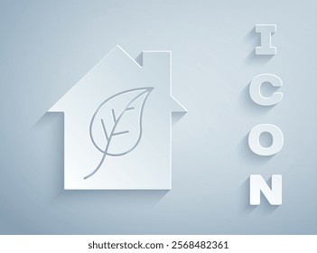 Paper cut Eco friendly house icon isolated on grey background. Eco house with leaf. Paper art style. Vector