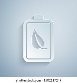 Paper cut Eco nature leaf and battery icon isolated on grey background. Energy based on ecology saving concept. Paper art style. Vector Illustration