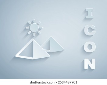 Paper cut Egypt pyramids icon isolated on grey background. Symbol of ancient Egypt. Paper art style. Vector