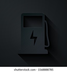 Paper cut Electric car charging station icon isolated on black background. Eco electric fuel pump sign. Paper art style. Vector Illustration