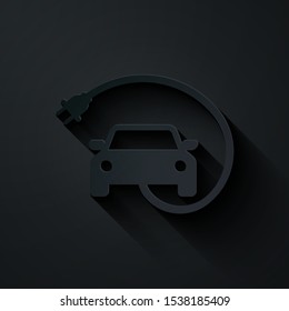 Paper cut Electric car and electrical cable plug charging icon isolated on black background. Renewable eco technologies. Paper art style. Vector Illustration