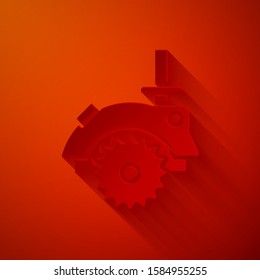 Paper cut Electric circular saw with steel toothed disc icon isolated on red background. Electric hand tool for cutting wood or metal. Paper art style. Vector Illustration