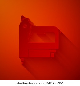 Paper cut Electric construction stapler icon isolated on red background. Working tool. Paper art style. Vector Illustration