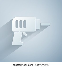Paper cut Electric drill machine icon isolated on grey background. Repair tool. Paper art style. Vector