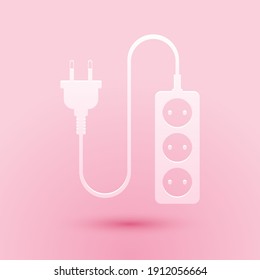 Paper cut Electric extension cord icon isolated on pink background. Power plug socket. Paper art style. Vector.