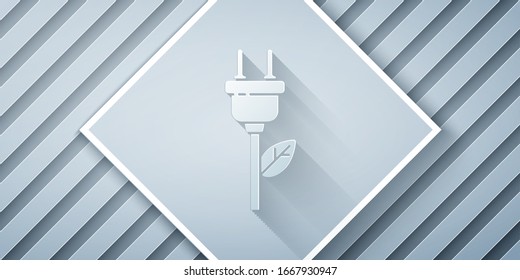 Paper cut Electric saving plug in leaf icon isolated on grey background. Save energy electricity. Environmental protection. Bio energy. Paper art style. Vector Illustration