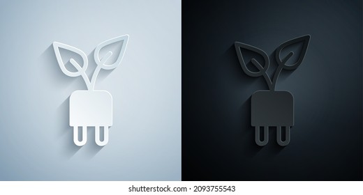 Corte de papel Enchufe de ahorro eléctrico en el icono de hoja aislado en fondo gris y negro. Ahorra energía eléctrica. Protección del medio ambiente. Energía biológica. Estilo de arte de papel. Vector