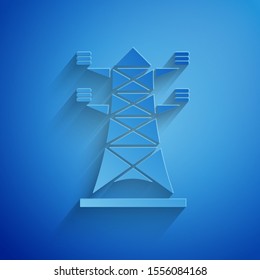 Paper cut Electric tower used to support an overhead power line icon isolated on blue background. High voltage power pole line. Paper art style. Vector Illustration