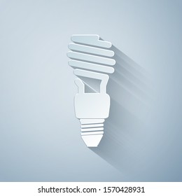 Paper cut Energy saving light bulb icon isolated on grey background. Paper art style. Vector Illustration