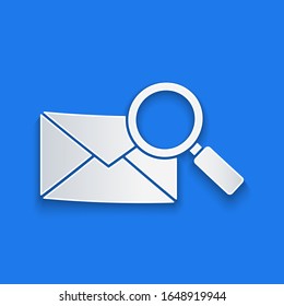 Paper cut Envelope mail with magnifying glass icon isolated on blue background. Paper art style. Vector Illustration